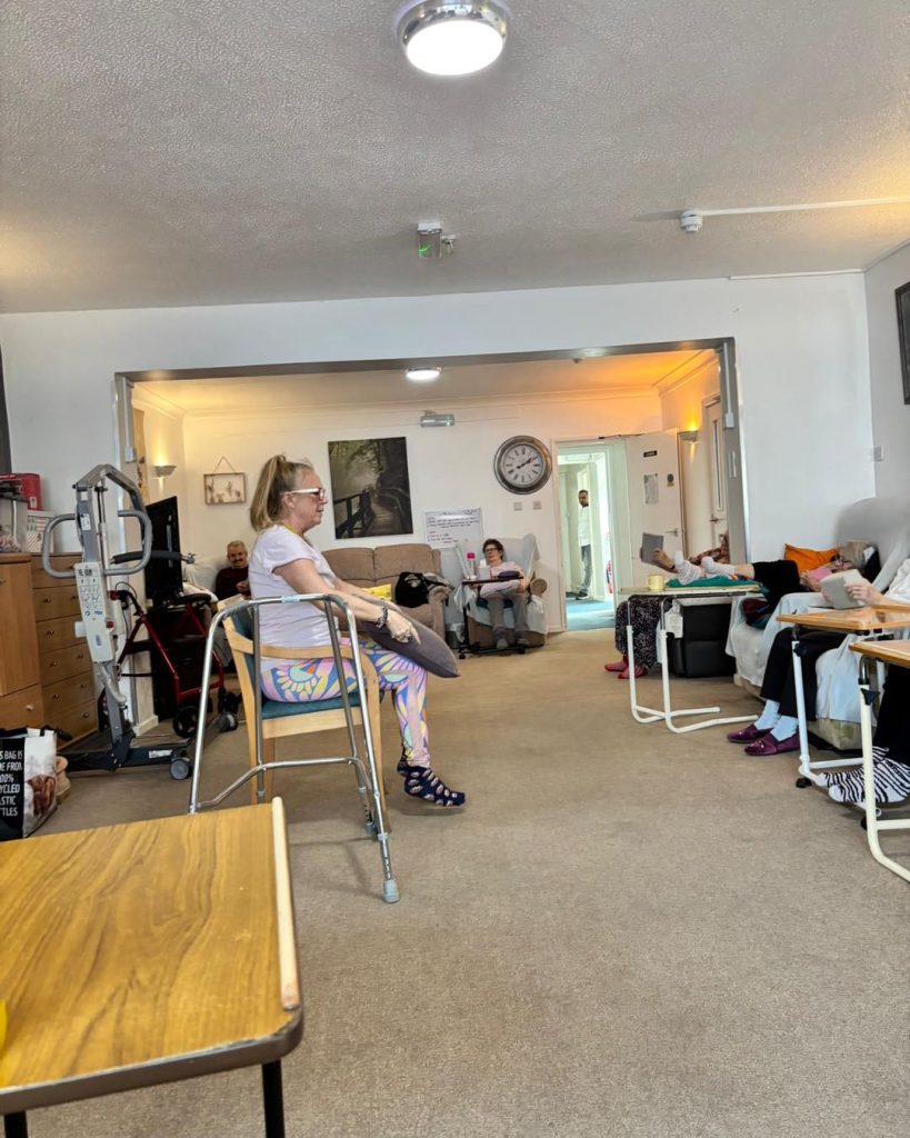 Group of seniors doing gentle exercises with an instructor