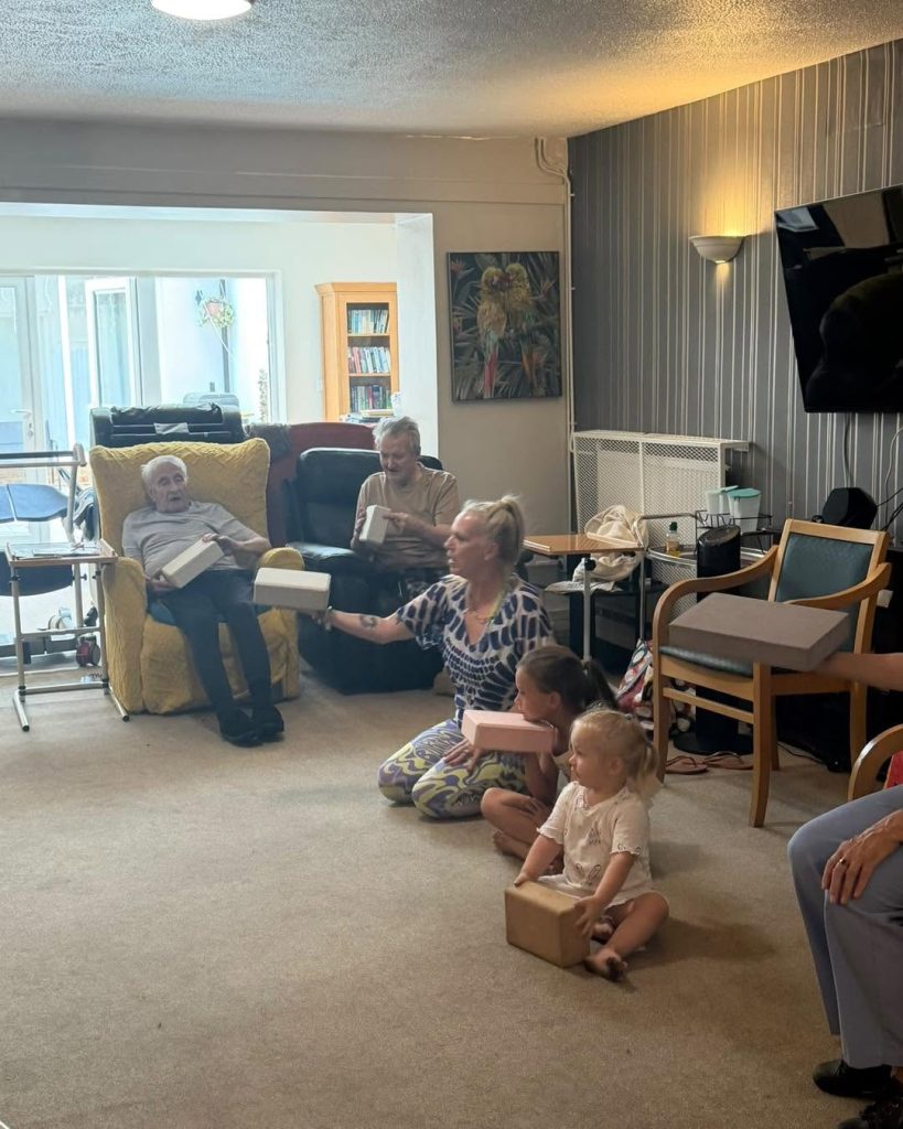 Care home residents and children taking part in a fun activity together.